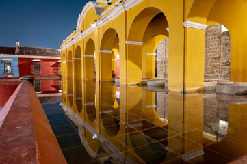Colonial arches of Tanque La Union in Antigua Guatemala at night