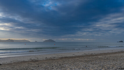 Beautiful sandy beach. A tropical island. The waves of the turquoise ocean are calmly rolling...