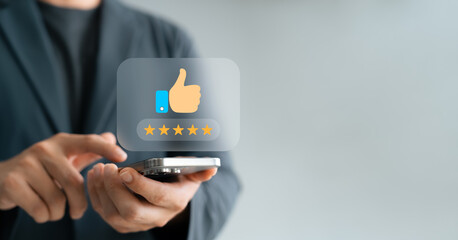 satisfaction engagement digital, Man using smartphone to give five-star rating with thumbs-up icon,...