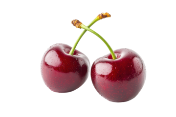 Two ripe, dark-red cherries, glistening with moisture, connected at their stems against a black backdrop