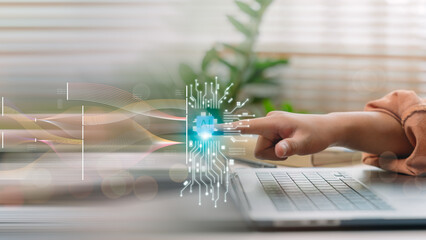 Finger activating AI interface on laptop with flowing data visualization, representing artificial...