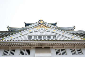 The beautiful decorated facade of the acient castle in Osaka outdoor at daytime in Japan with space for text.