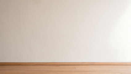 Empty room with white wall and light wood floor