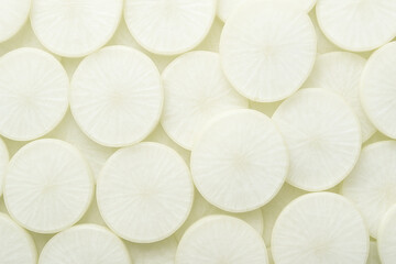 Crisp White Sliced Daikon Radish Offering a Clean and Fresh Vegetable Background