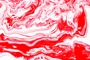 Curved lines in acrylic paint on a white background, reminiscent of a marble surface. Modern abstract background for design. A copy space.