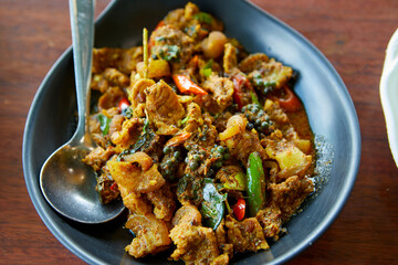 Close-up view of stir-fried spicy Boar in plate