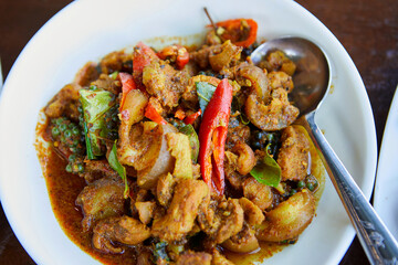 Close-up view of stir-fried spicy Boar in plate