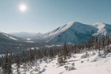 breathtaking view of ural mountains illuminated by bright sunlight showcasing majestic peaks and valleys