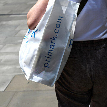 LONDON, UK - MAY 31, 2025:  Lady holding Primark shopping bag in Oxford Street West End