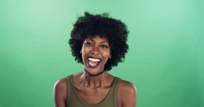 Portrait, smile and laugh with black woman in studio funny joke, comic reaction and crazy story. Person, space and silly expression for comedy, feel good and positive attitude on green background