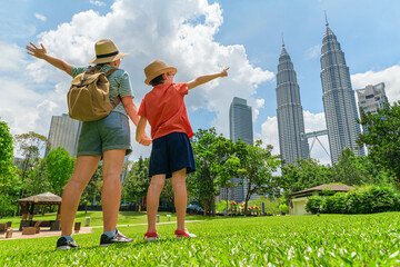 Female tourist and her son enjoying cityscape of Kuala Lumpur