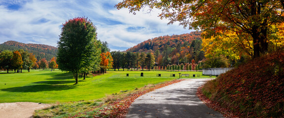 Scenic panoramic view of Golf course landscape in rural Vermont during autumn time.