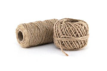Close-up shot of two spools of natural twine on a pristine white background.