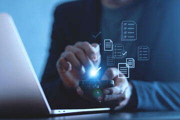 Checklist business performance monitoring concept, Business using smartphone and laptop online survey filling out check digital form task.