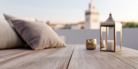 A teak wood tabletop adorned with a softly blurred outdoor setting features decorative pillows, a lantern, and a candle, creating a serene ambiance