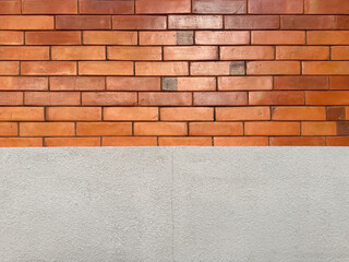 Smooth red brickwall or clay brickwall texture on an exposed wall. In red and orange color. With...