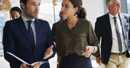 Business, people and file with talking in office for case preparation, feedback and testimony. Law firm, lawyers and teamwork with paperwork for legal justice, lawsuit advice and strategy development