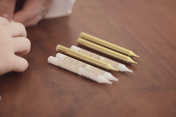 making candles for a birthday cake, unpacking