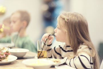 Children's party children at the table, children's birthday dinner