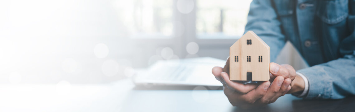 Home Insurance Coverage Estate Residential concept. Businessman hand type the keyboard computer, insurance and save money Insurance payments,Home cost planning, Real estate Property insurance