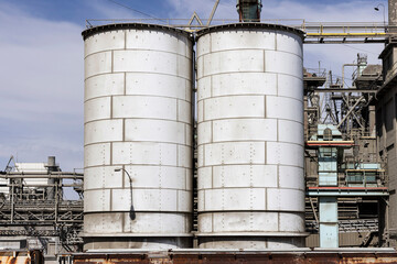 Industrial scene with matching storage tanks