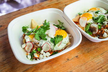 Breakfast bowls with eggs in to-go containers