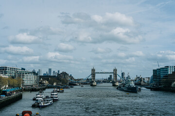 View of Tower Bridge and River Thames under cloudy sky