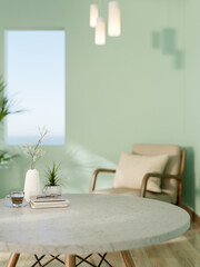 Books and coffee on marble table with armchair near rectangular hole in green mint wall living room.
