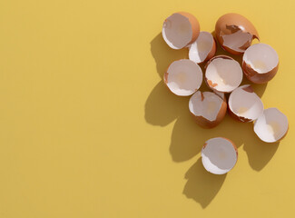 Broken eggshells on blue background,Easter minimal concept.