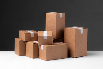 Stacked cardboard boxes against a dark background