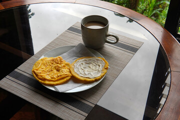 Typical Costa Rican breakfast: tortilla with egg and tortilla with custard and coffee, in spanish tortilla con huevo y tortilla con natilla.