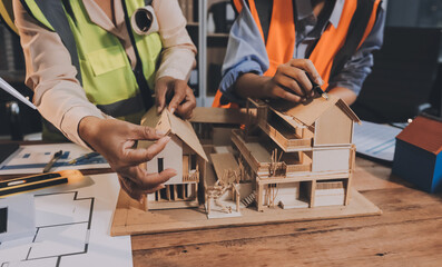 Engineers are helping to design work on blueprints and collaborate on structural analyzing of project types.