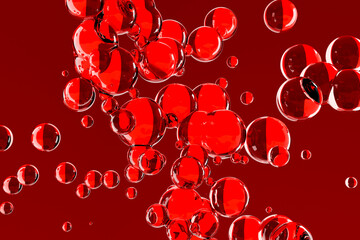 Red transparent bubbles floating in a deep red background, resembling blood cells or molecules....
