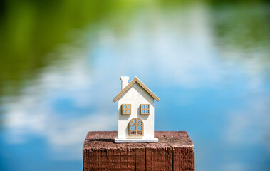The symbol of the house stands against the water
