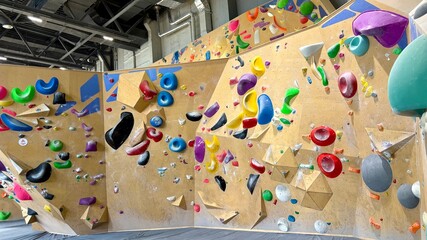 A modern climbing wall for sports. Mountaineering and rock climbing.
