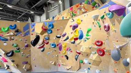 A modern climbing wall for sports. Mountaineering and rock climbing.
