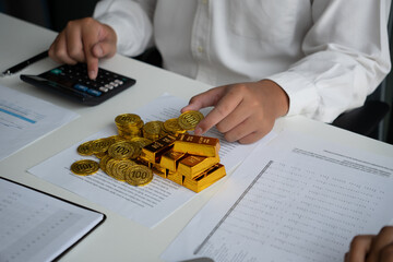 Businessmen discuss investing in gold bars and stocks