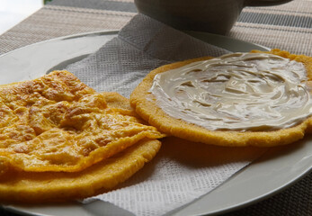 Typical Costa Rican breakfast: tortilla with egg and tortilla with custard and coffee, in spanish tortilla con huevo y tortilla con natilla.