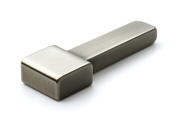 Close up of a modern brushed metal cabinet pull or drawer handle on a white surface studio shot