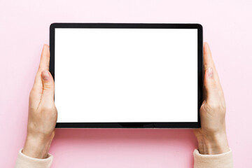 female teen hands using tablet pc with white screen, Mockup image of woman hand holding white tablet pc with blank white screen at home
