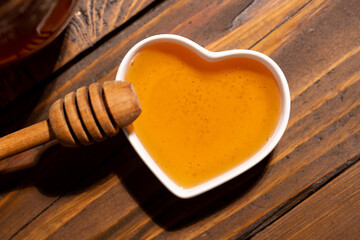 Fresh floral honey in a heart-shaped bowl