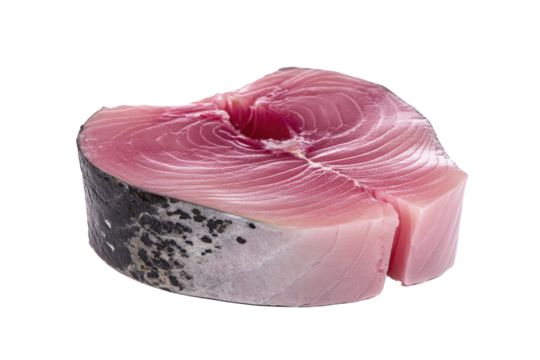 A single tuna steak cutlet with visible grain and dark skin isolated on a black background view