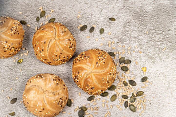 cereal Kaiser , Whole grain bread on concrete background. A bunch of Kaiser rolls with sesame...