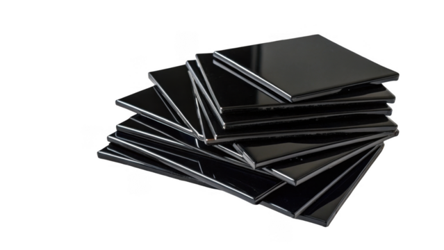 Glossy black ceramic tiles neatly stacked, showcasing a modern and sleek design. Perfect for interior design projects, these tiles offer a sophisticated and stylish finish