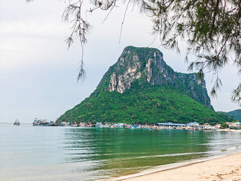 030625030 Lush green mountain overlooks a coastal village and calm bay. Ao Noi Sea view Prachuap Khiri Khan