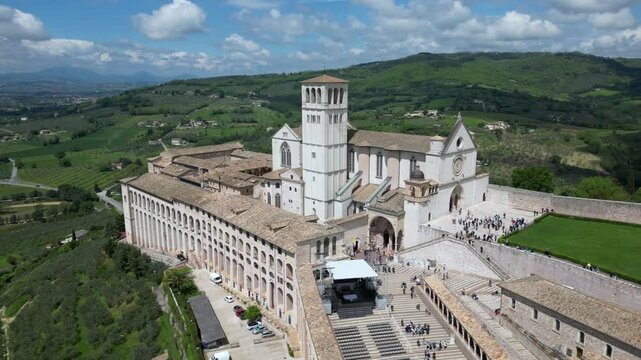 EUROPE, ITALY ASSISI 06,04,2025 The Basilica of Saint Francis San Francesco  in Assisi, Umbria.Drone aerial view of Papal Patriarchal Basilica of Saint Francis and the historic city with tiled roofs