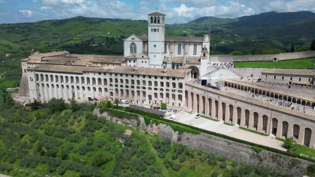 EUROPE, ITALY ASSISI 06,04,2025 The Basilica of Saint Francis San Francesco  in Assisi, Umbria.Drone aerial view of Papal Patriarchal Basilica of Saint Francis and the historic city with tiled roofs