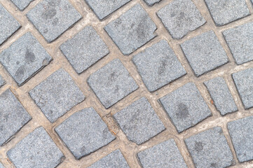 stone wall texture,Paved stone sidewalk texture background, Street blocks background, Gray cobblestone texture captured in natural daylight