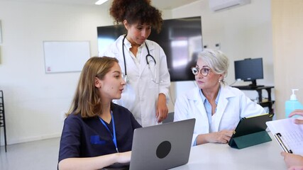 Medical team collaborating in a hospital meeting room - Powered by Adobe