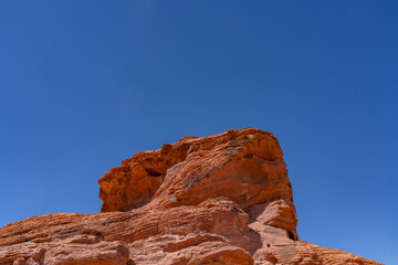 Fototapeta premium Aztec Sandstone, Early Jurassic geological formation of primarily eolian sand . Valley of Fire Road / Highway / State Park, Clark County, Nevada geology. Weathering. Beehive rock formations